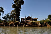 Inle Lake Myanmar. All the buildings are constructed on piles. Residents travel around by canoe, but there are also bamboo walkways and bridges over the canals, monasteries and stupas. 